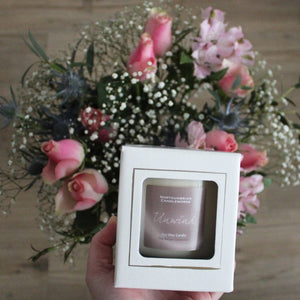 unwind candle from the relax collection - gift with flowers